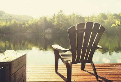 chair on a dock by the lake